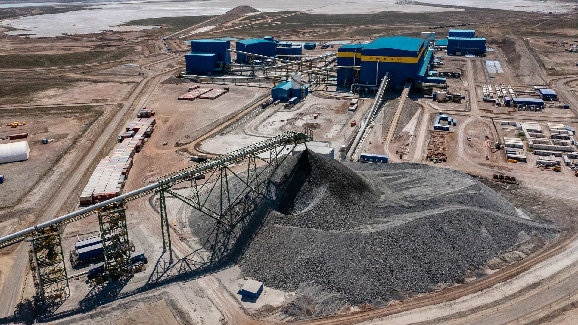 Daytime aerial drone style view of Aktogay mining operations facilities. 