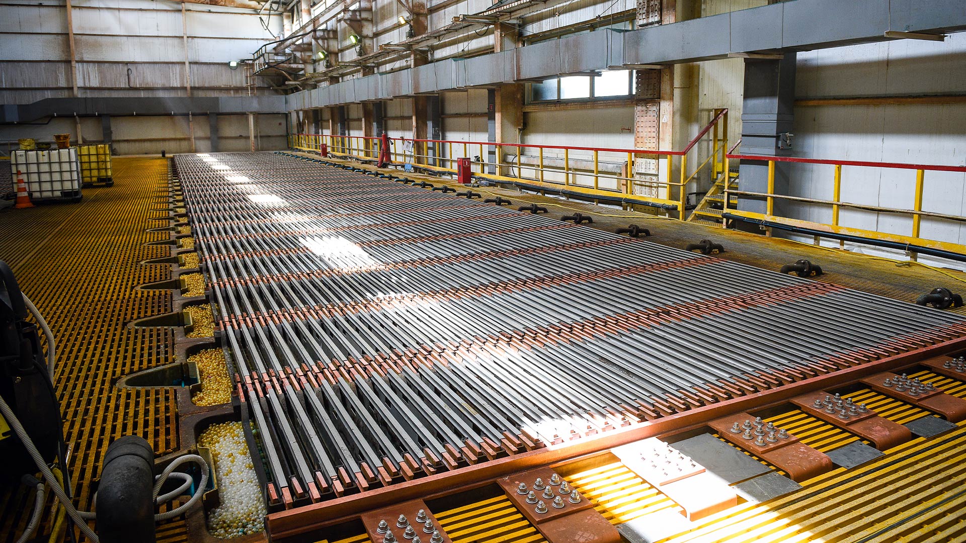 Inside of facilities showing racking, railings and vast space. 