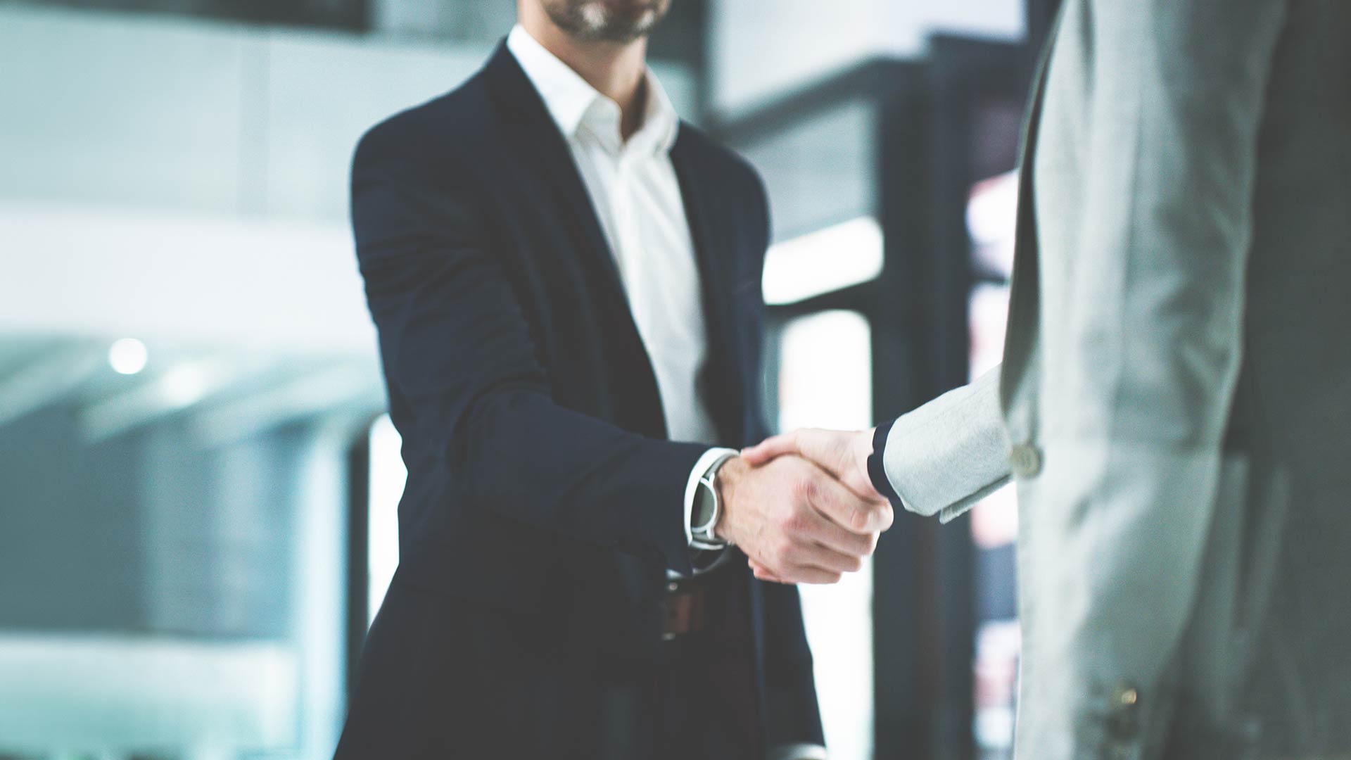 Two business men shaking hands. 